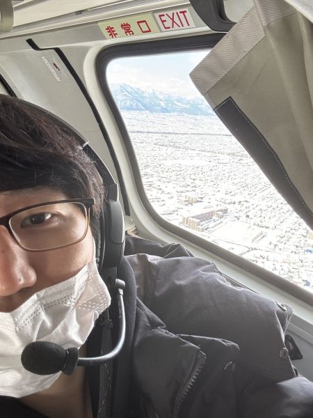 STVヘリコプター機内から、野付半島へ向かう途中の札幌の上空です。空の撮影はトラブルも多く大変ですが、ここから見る景色は格別です。技術 能代